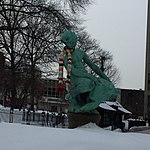 view of the Burnside Fountain surrounded by snow with a scarf wrapped around Turtle Boy's neck