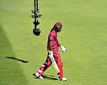 West Indies opener Chris Gayle walks back after being out