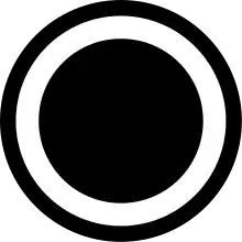 A black circle outline with a smaller, filled in black circle inside it.