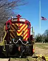 Fort Eustis's GP16 diesel locomotive sits silently under the Post flag which is at half mast for former President Gerald Ford who died that day.