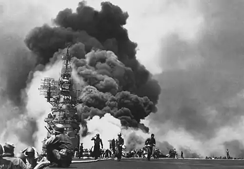 USS Bunker Hill hit by two Kamikazes