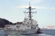 Flight IIA ship USS Mustin without TACTAS and no Harpoon launchers, but with helicopter hangars and new exhaust stacks design