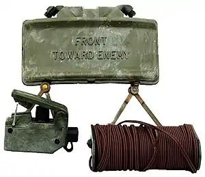 M18A1 Claymore mine with the M57 firing device and M4 electric blasting cap assembly