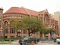 Nicholas J. Clayton's "Old Red" built in 1891, is on the campus of the University of Texas Medical Branch in Galveston and is a registered Texas historic landmark.