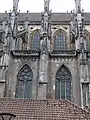 Northern façade clerestory. The upper levels of the nave are built in stone while the rest of the church is built of brick.