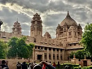 The Umaid Bhawan Palace at Jodhpur built between 1929 and 1942 is one of the largest royal palaces in the world. It was designed by Henry Vaughan Lanchester in a blend of Beaux-Arts and traditional Rajput styles.