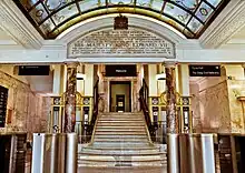 Picture of the Polytechnic (now the University of Westminster) on Regent Street, showing the inside of the lobby with a staircase leading to the next floor