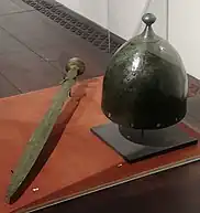 Bronze helmet and sword from Romania