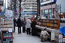 Sidewalk book shelves at a store in Jimbōchō Book Town