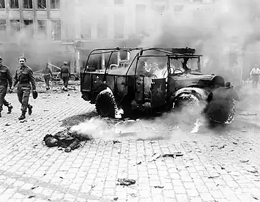 Image 14V-2 rocket attackPhoto credit: Ingeldew, T3c, U.S. ArmyThe smouldering body of a boy killed by a V-2 rocket attack on the main intersection in Antwerp, Belgium, November 27, 1944, on the main Allied supply line to the Netherlands. The V-2, one of the German Vergeltungswaffen, was the first ballistic missile and first man-made object to achieve sub-orbital spaceflight. Over 3,000 V-2s were launched as military rockets by the Wehrmacht against Allied targets in World War II.More selected pictures