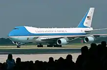 Image 34A Boeing 747 aircraft with livery designating it as Air Force One. The cyan forms, the US flag, presidential seal and the Caslon lettering, were all designed at different times, by different designers, for different purposes, and combined by designer Raymond Loewy in this one single aircraft exterior design. (from Graphic design)