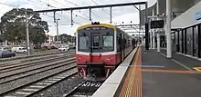 A train sitting at a platform at Frankston station.