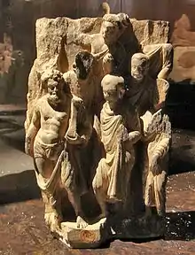 Vajrapāni with a group of Buddhist monks. Gandhara