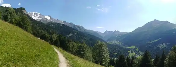 Summer view of the valley of Les Contamines ; left: the snow-capped Dômes, facing  Mont-Joly.