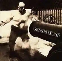 A black-and-white photograph of a man being shot in the stomach with a cannonball