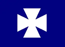 Badge of the 2nd Division, V Corps, Army of the Potomac. White cross pattée on azure field.