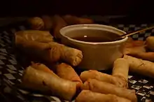 Image 43Spring rolls are a large variety of filled, rolled appetizers or dim sum found in Chinese cuisine. Spring rolls are the main dishes in Chinese Spring Festival (Chinese New Year). (from Chinese culture)