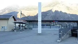 Canopy-covered platform with mountains in the distance