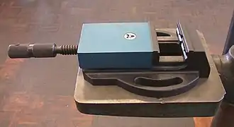 A small machine vise used in a drill press