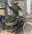 A man hauling material with a bicycle in Vietnam