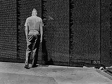 A Marine at Vietnam Veterans Memorial on July 4, 2002, designed by Maya Lin