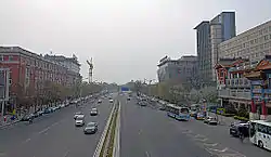 Looking west from Dongsi along Dongsi West Avenue with Jingshan visible in the distance