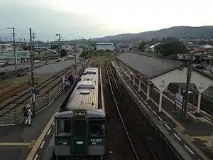 A view of the platforms looking in the direction of Takamatsu. The passing loop can be seen to the left of the side platform. Further to the left of it can be seen the traces of the trackbed of the former track to Kajiyabara.