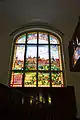 Stained glass with the image of Olomouc in the living room