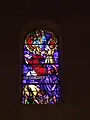 Stained glass window depicting the martyrdom of Saint Stephen