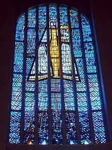 The principal window of the Temple of Maipú, Chile, depicting the Virgin Mary and Christ Child, by Adolfo Winternitz, showing the traditional use of blue as the predominant colour, emphasising an association with Heaven and creating an ambience in the interior.