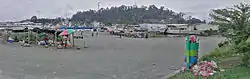 Panoramic photo of Voco Point Lae facing north, yacht club, Mount Lunaman and Lutheran Shipping in center of photo