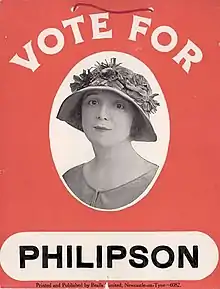 A red placard with a monochrome head-and-shoulders photo of Philipson