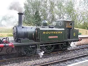 Freshwater on a visit to the Bluebell Railway (November 2006). The engine has one of the extended "Isle of Wight" coal bunkers (used to increase coal capacity on the longer journeys), which finishes closer to the end of the frames.