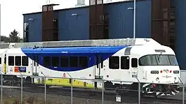 A WES train parked next to the maintenance building. Each of WES's Colorado Railcar-built cars has one streamlined end (on the right in this view) and one non-streamlined end.