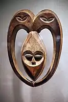 Kwele mask; 19th–20th century; wood coloured with kaolin; from Gabon or Democratic Republic of Congo; height: 52.7 cm (203⁄4 in.), width: 38.1 cm (15 in.); depth: 10.2 cm (4 in.); Metropolitan Museum of Art. This mask was used in the rituals of witchcraft protection