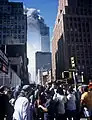 The North Tower burning behind WTC 7.