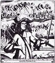 Black and white print shows a scowling man carrying a torch in each hand. The man wears a shoulder-length black wig and clothing of about 1700. In the background, a city and a farm are in flames.