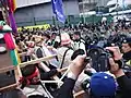 Korean protesters confronted with Hong Kong police in the defense line in Hung Hing Road in Wanchai.