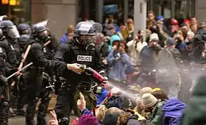 Protestors being pepper sprayed outside the WTO conference