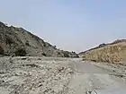 Wadi Tayyibah, with a stretch of the old tarmac road visible in the wadi bed.