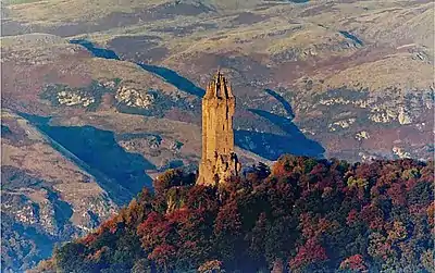 Image 4The Wallace Monument is a sandstone tower, built in the Victorian Gothic style. It stands on the summit of Abbey Craig,  a volcanic crag above Cambuskenneth Abbey, from which Wallace was said to have watched the gathering of the army of English king Edward I, just before the Battle of Stirling Bridge.Photo credit: Ray Mann