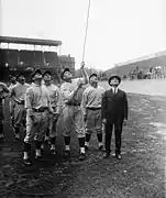 The Washington Senators led by star Walter Johnson and owner Clark Griffith hoist their championship banner at the 1925 opening day.