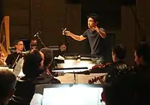 Hokoyama conducting in 2009