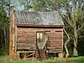 One of the uninhabited railroad houses that line the WPA Highway