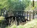 A wooden bridge crossing the railroad in eastern Waverly