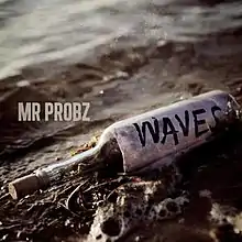 A message in a bottle that reads "Waves" with the bottle being washed over by waves.