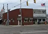 Red brick building is now a Native American Culture Museum and the lighter brick building is the post office