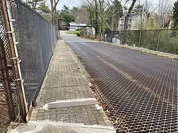 The bridge's sidewalk, with its corroded rebar visible.