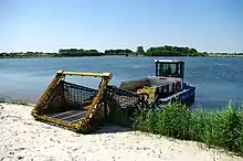 The conveyor belt on this weed harvester from the German manufacturer Berky transports the aquatic plants on its hold after cutting them