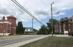 Center of Wentworth, with the former jail at left and the former county courthouse at right